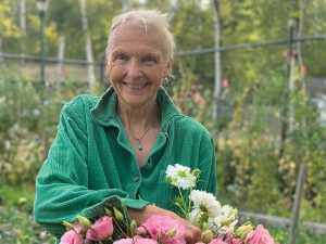 Barb Brant of Foolish Blooms holding flowers