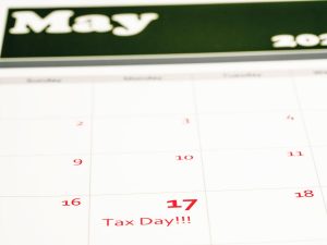 Photo of May calendar indicating extended tax filing deadline