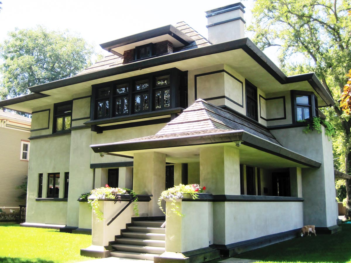 Photo of a white stucco Craftsman house