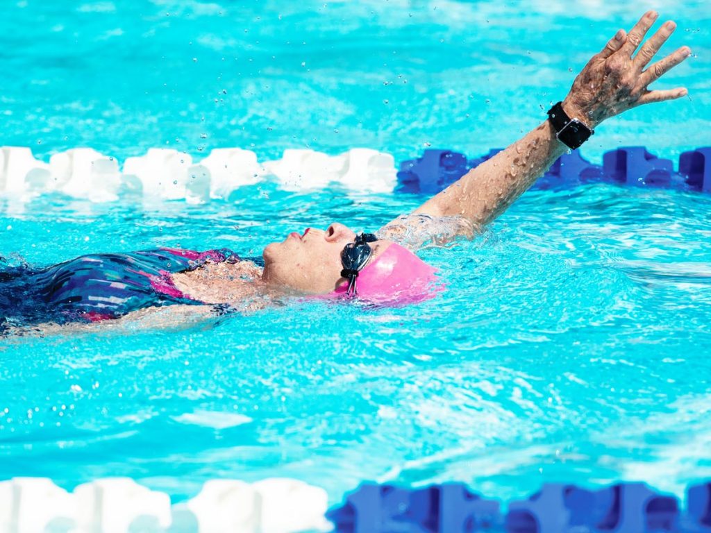 Senior woman swimming the backstroke in the Montana Senior Olympics
