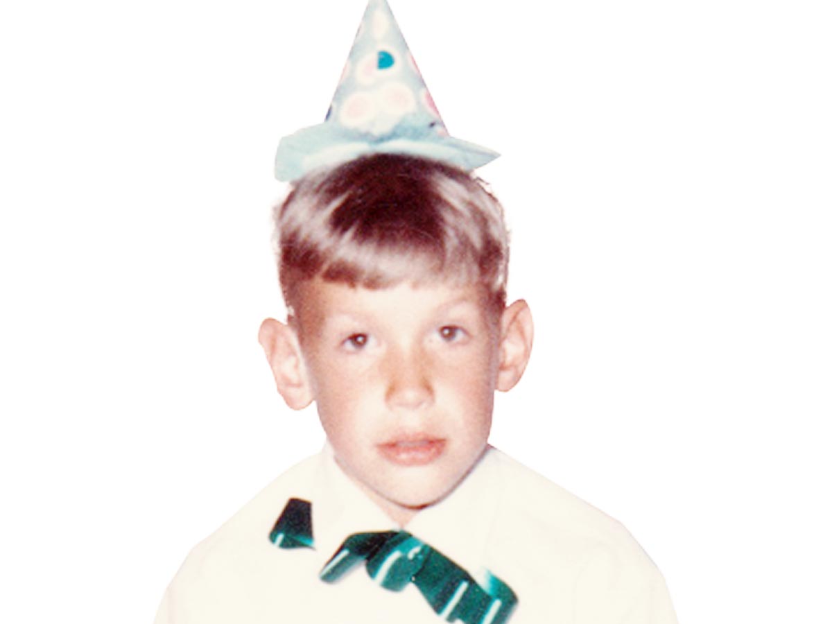 Photo of Bob Hunt, publisher of Montana Senior News, as a child, wearing a party hat.