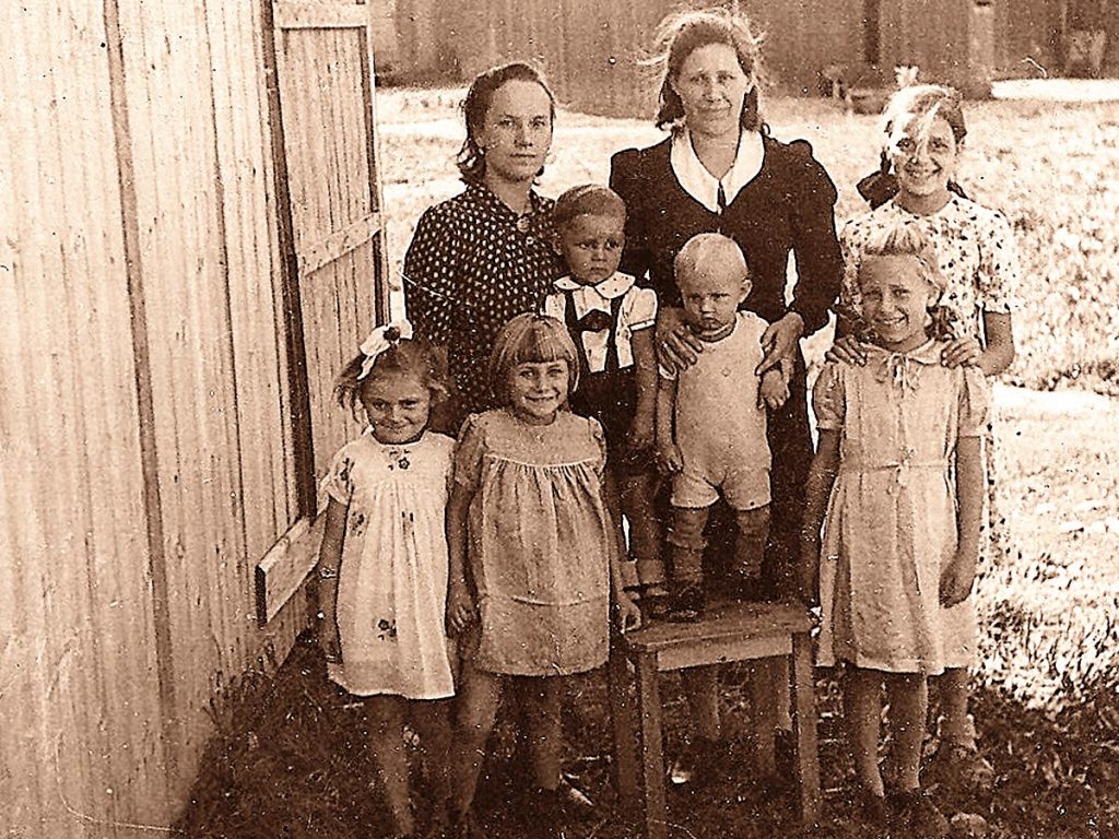 Photo of John Kunz’s family at the Ramsentahl Labor Camp in Bayreuth, Germany in 1945.