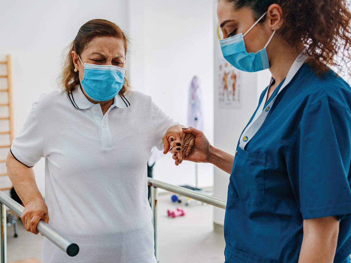 Photo of a female stroke patient doing physical therapy.