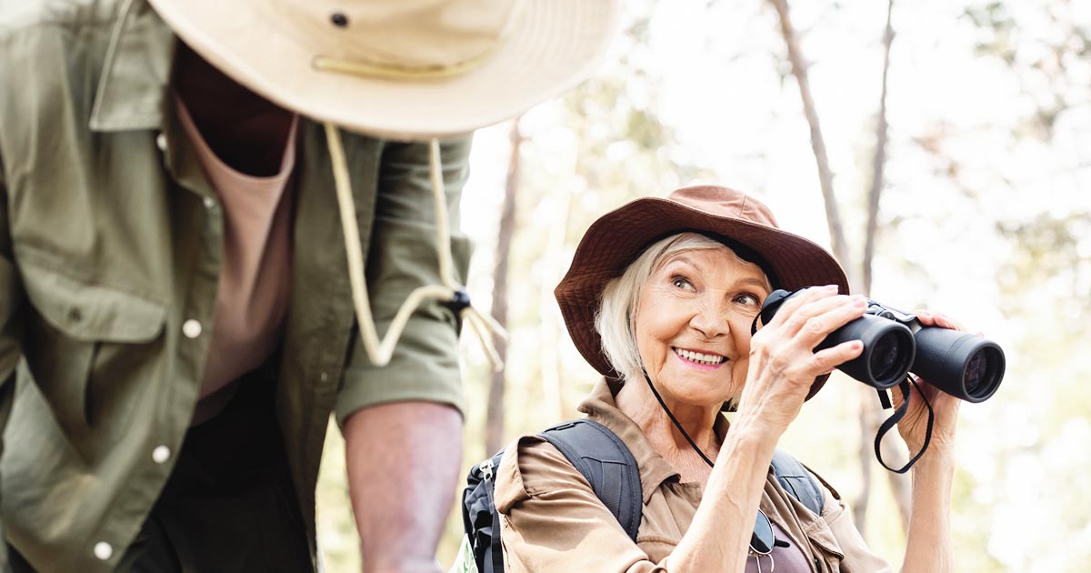 Educational trips are popular among retirees. Here is a senior woman travel with a tour guide.