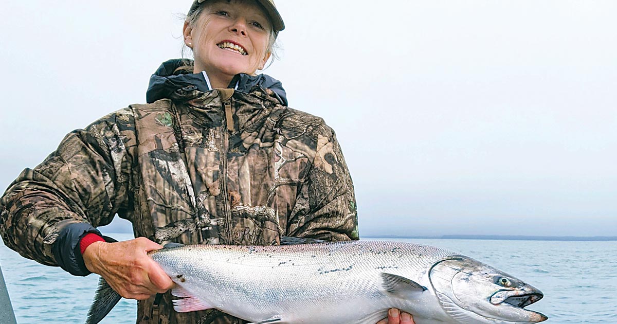 Author Holly Endersby with a fresh catch — fishing in rural Alaska