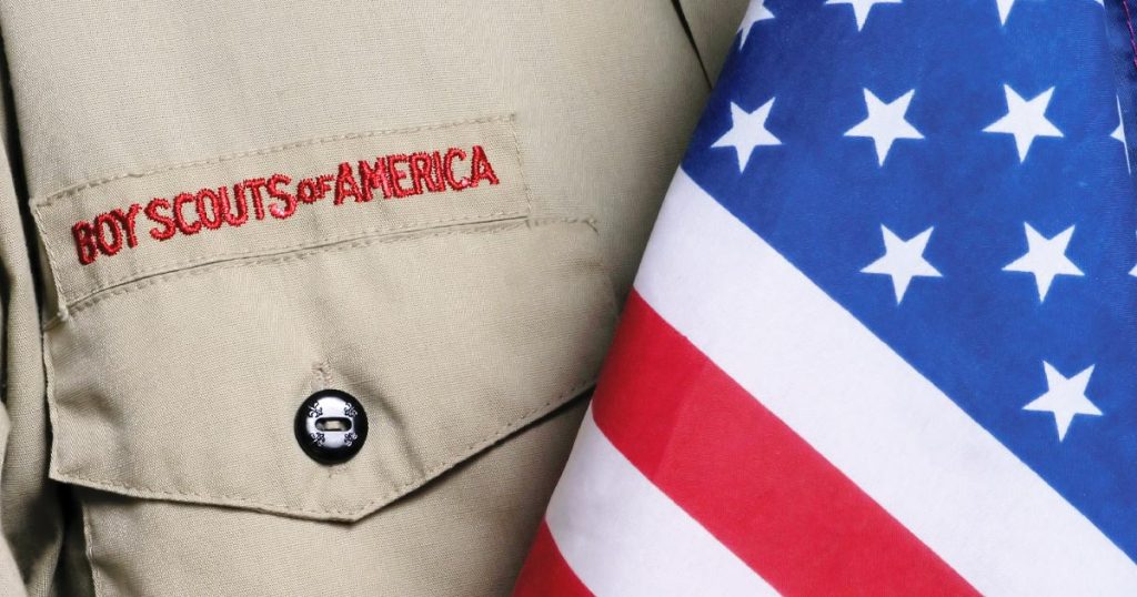Closeup photo of a boy scout uniform and America Flag