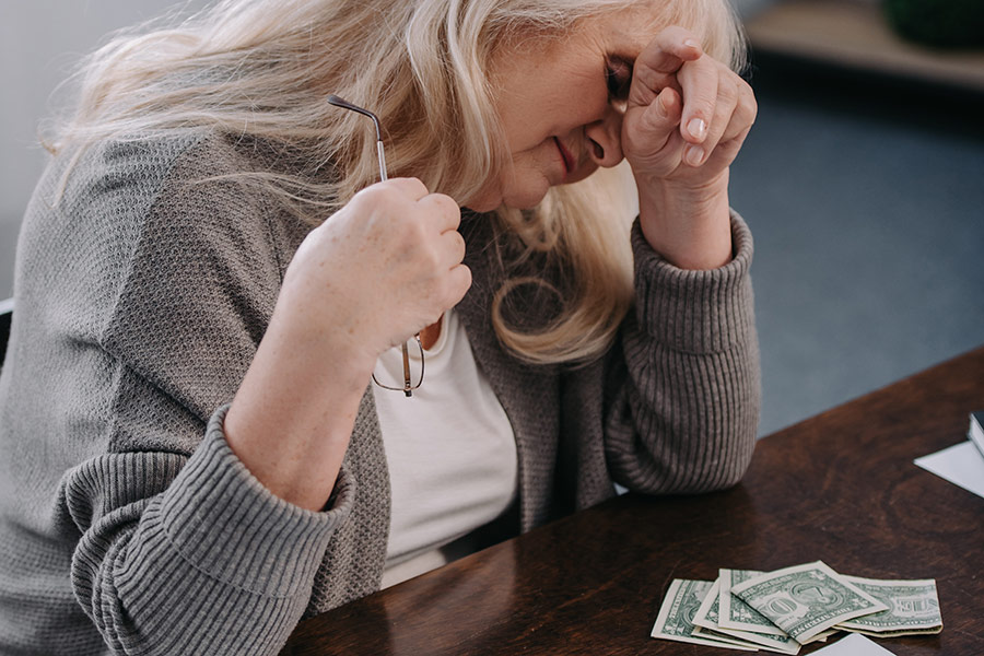 Woman stressing over finances.
