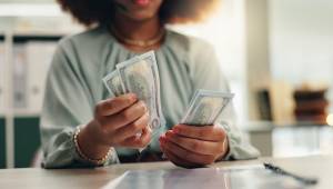 Woman counting bills